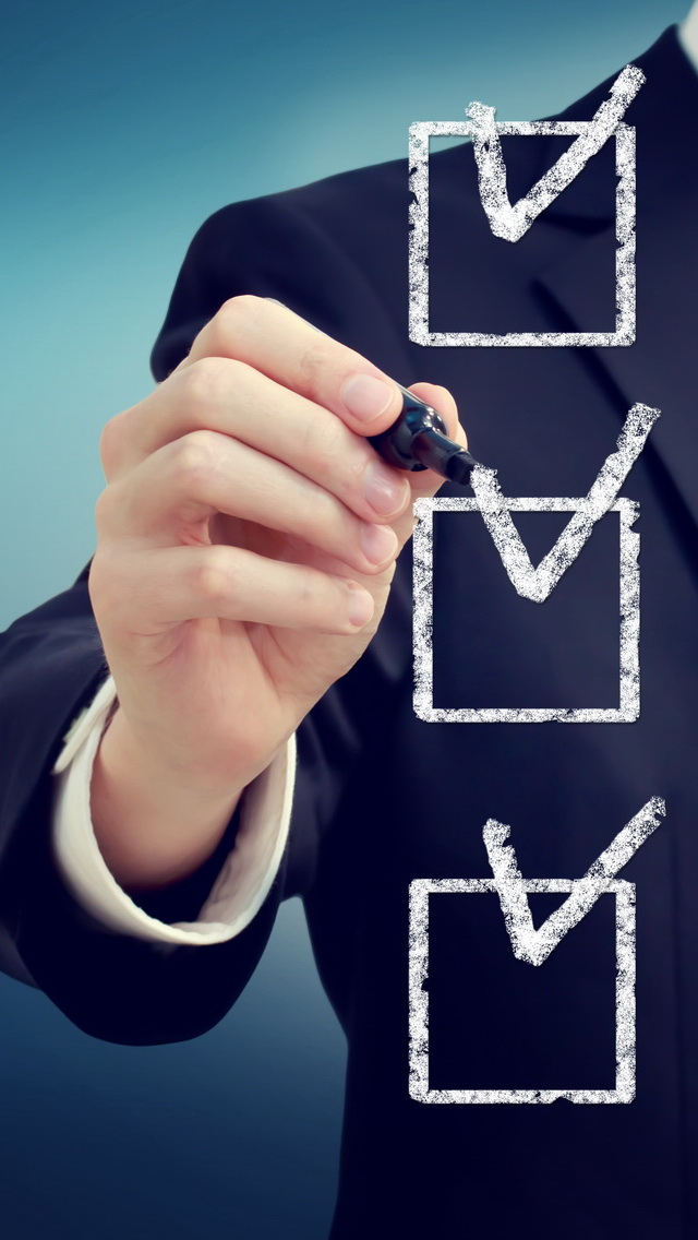 Business man with check boxes over navy blue background