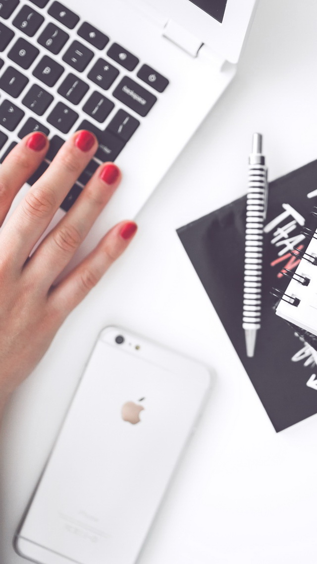 woman-hand-smartphone-desk